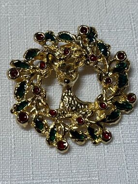 Gold-tone Reindeer Wreath Brooch with Green and Red Accents